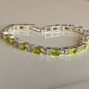Avon vintage silver tone and green oval rhinestone tennis bracelet.